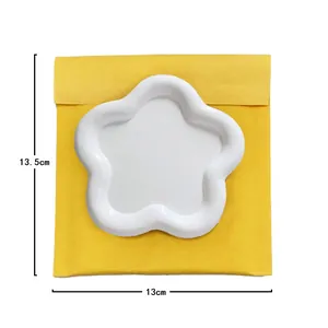 Detailed top view of white flower-shaped resin tray with dimensions 13.5cm by 13cm