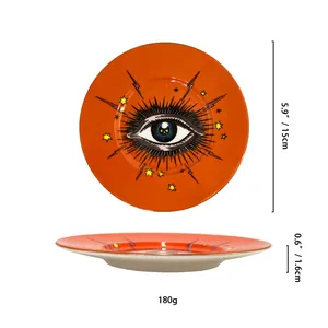 Nordisches orangefarbenes Keramik-Schmucktablett mit Goldrand und Augenmuster, 15cm