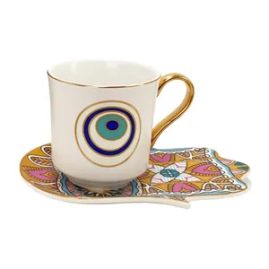 Set tazzina da caffè in ceramica Occhio di Allah e piattino Mano di Fatima oro