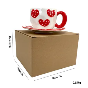 Ceramic coffee cup set with red heart pattern and square cardboard packaging box details