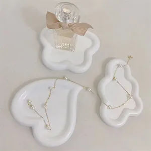 Minimalist white resin decorative trays set with irregular cloud and heart shapes