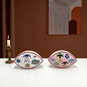 Artistic evil eye ceramic decor with gold trim, mystical hand-painted patterns