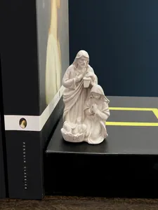 Macro detail of white resin Holy Family nativity scene figurine with matte finish