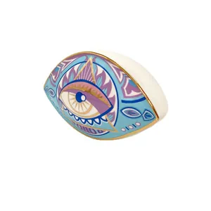 Nordic ceramic evil eye decorative ornament with gold-rimmed edges and blue geometric patterns
