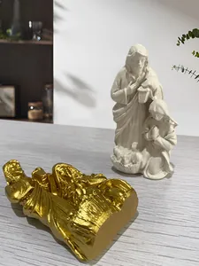 Detail of Holy Family resin statues with matte cream and gold metallic finish