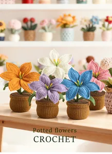 Group of five colorful handmade crochet potted lily flowers on a wooden desk
