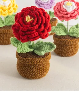 Detail view of colorful crochet peony flower pots in red, yellow, pink and purple yarn