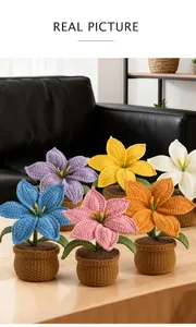 Detail of six colorful hand-crocheted lilies in woven pots for home desktop decoration