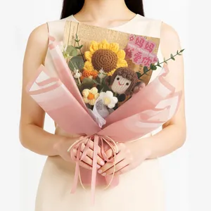 Handcrafted knitted sunflower bouquet with a cute doll in pink gift wrapping paper