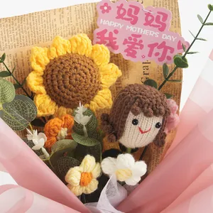 Detail of hand-crocheted sunflower bouquet with small doll and Mother's Day gift card