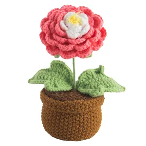 Handmade pink and white crochet camellia potted plant with knitted brown base decoration