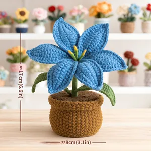 Handmade crochet blue lily potted plant for desk decoration with yellow stamen details