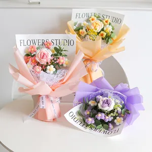 Detail of handcrafted crochet flower bouquets with knit daisies and roses in gift wrap