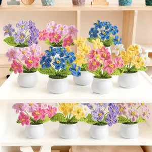 Handmade crochet forget-me-not potted flowers in various colors for home decor display