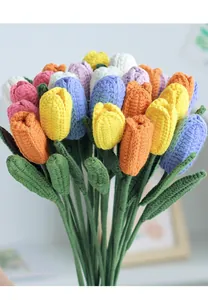 Close-up of hand-knitted tulip bouquet showing detailed crochet textures and vibrant colors