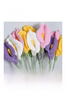 Macro shot of handmade crochet calla lily bouquets with detailed knitted texture and colors