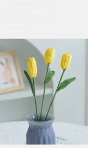 Detailed knit yellow tulip bouquet in a blue geometric vase for home decoration