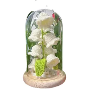Handmade crochet lily of the valley night light in glass dome with wooden base