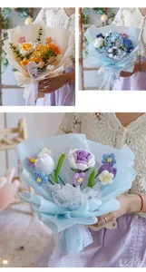 Close-up of hand-knitted flower bouquet with roses and tulips in premium gift wrap
