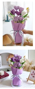 Detail of handcrafted crochet bouquet with purple hearts and tulips in gift packaging