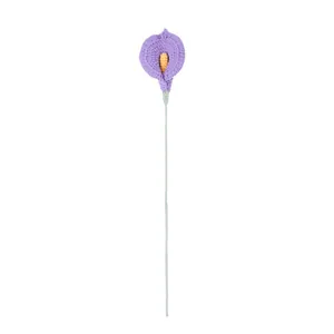 Handmade crochet Calla Lily flower in purple yarn with orange stamen on white background