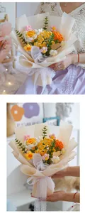 Detail of hand-knitted flower bouquet with yellow roses and orange gerberas in gift wrap