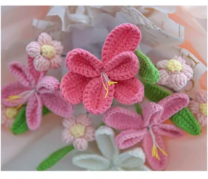 Macro detail of hand-knitted pink and white tulip bouquet with crochet yarn texture
