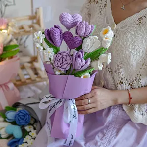 Handmade crochet flower bouquet with purple roses and heart decor in elegant wrap