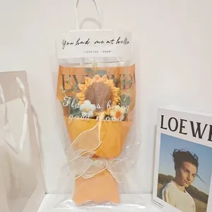 Handcrafted crochet sunflower bouquet in a luxury gift bag with elegant packaging