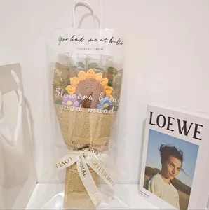 Handmade crocheted sunflower bouquet in retro gift paper and clear tote bag