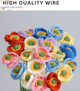Close-up of hand-crocheted colorful poppy bouquet with detailed knitted textures