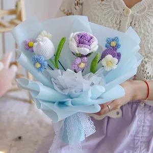 Handmade crochet bouquet with tulip and rose flowers in blue wrapping for Valentine's gift