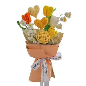 Handmade crochet bouquet with tulips, daisies and hearts in peach gift wrapping