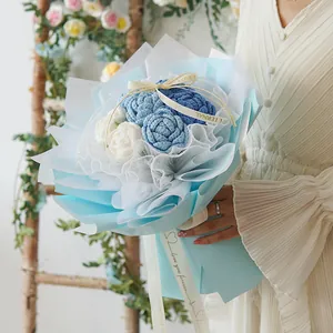 Handmade knitted blue and white rose bouquet in premium wrapping for gift giving
