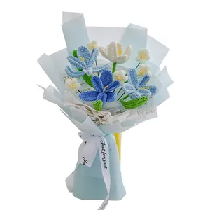 Handmade crochet blue and white tulip bouquet in elegant light blue gift wrapping paper