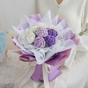 Handmade crochet bouquet with purple and white wool roses in elegant multi-layer wrapping