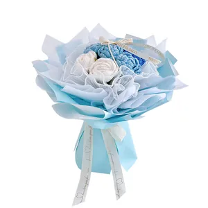 Handmade crochet rose bouquet in blue and white wrapping with Love Is Eternal ribbon