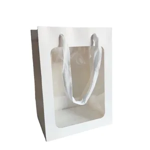 Weiße Geschenktüte aus Papier mit großem Sichtfenster und Fischgrät-Tragegriffen