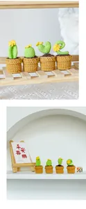 Detailed view of four handmade crochet cactus plants in mini pots for home decoration