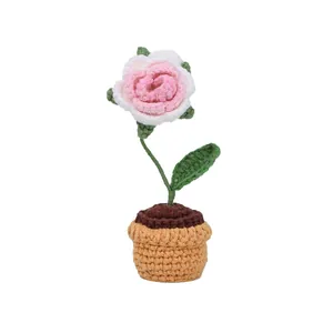 Handmade crochet pink and white rose in a yellow flower pot for home or car decor