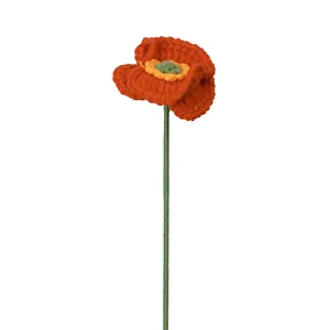 Handcrafted crochet red poppy flower bouquet with intricate knitted texture on white background