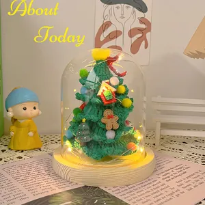 Handmade crochet Christmas tree in glass dome with warm LED lights and wooden base