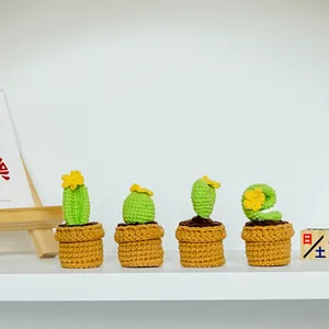 Set of four handmade crochet cactus potted plants with yellow flowers for home decor