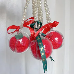 Handmade knitted Christmas apple ornaments with gold snowflake bows and pearl chains