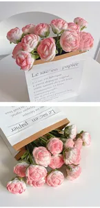 Detail of handmade crochet pink rose bouquet with intricate petal textures and green leaves