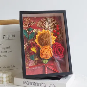 Handmade crochet flower photo frame with sunflowers and roses in a black frame gift box