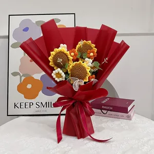 Handmade knitted sunflower bouquet in red gift wrap for graduation or home decor
