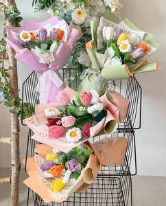 Close-up of handmade crochet tulip bouquet set in a metal basket with premium gift wrapping