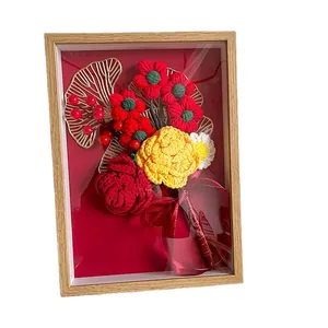 3D handmade crochet flower bouquet in a light wood frame with red ribbon decoration