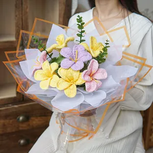 Hand-held bouquet of colorful hand-knitted crochet flowers with love you forever ribbon